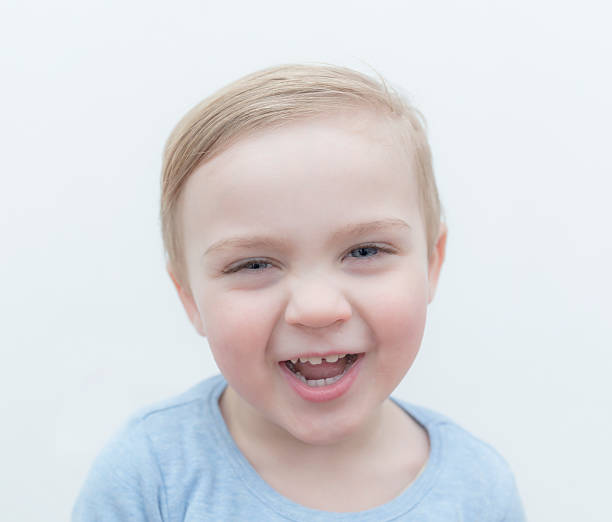 istock smiling 2 year old caucasian boy with tooth gap 531163533