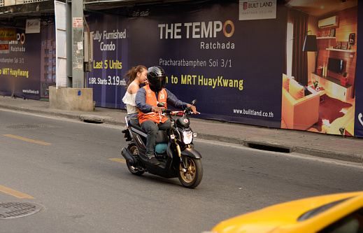 Bangkok, Thailand - January 4, 2015. Unidentified rider of motorcycle taxi.