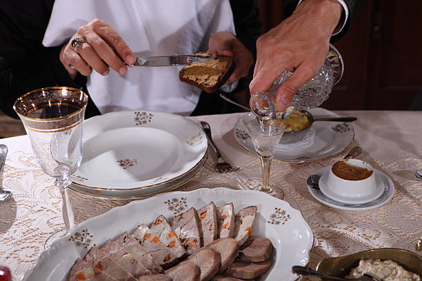 Hands pours vodka and spreadable paste