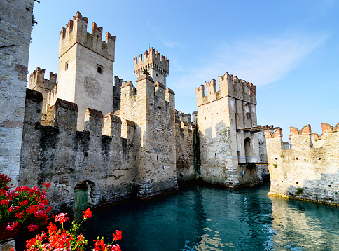 Sirmione, Italy - June 4, 2015: Lagoon in the Scaliger Castle. The famous castle of Sirmione and its small port are an uncommon example of a fortress used as a port. The building of this complex started in 1277 by Mastino della Scala.