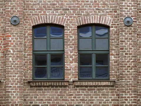 Two windows in an old industrial building