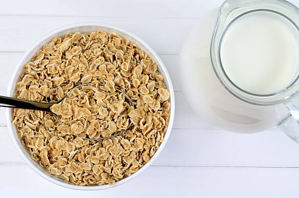 istock Bowl with healthy oats and milk on table 531168694