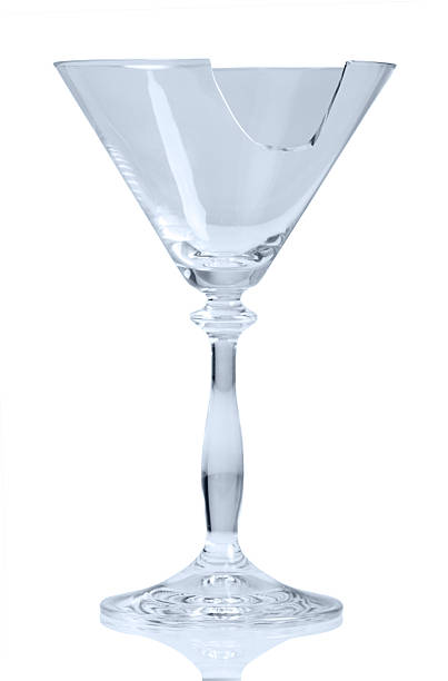 istock Broken glass of cocktail isolated on white background 531169540