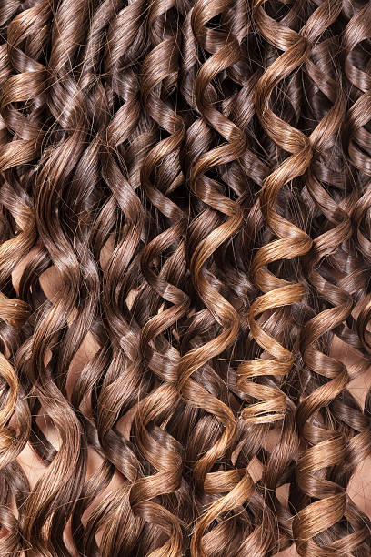istock Curly brown hair closeup, background 531170692