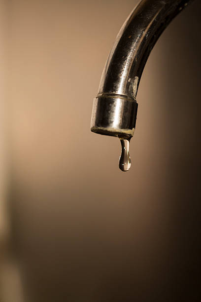 istock photo of a faucet head leaking 531171334