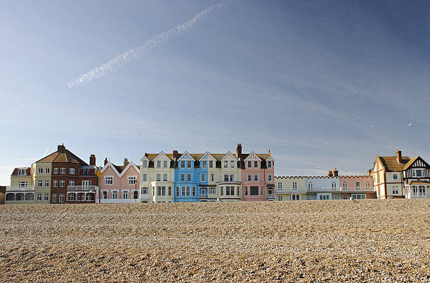 Row of coloured houses on Aldeburgh seafront, Suffolk, UK The colourful row of seafront houses in the popular coastal town of Aldeburgh, Suffolk, UK on a sunny spring day. suffolk england stock pictures, royalty-free photos & images