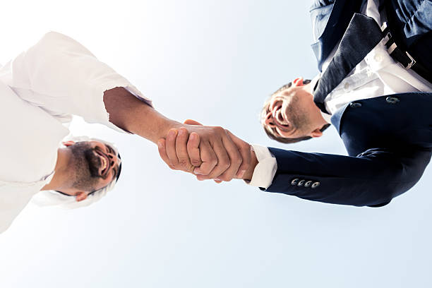 istock Middle Eastern Man and European Business Man Shaking Hands 531173466