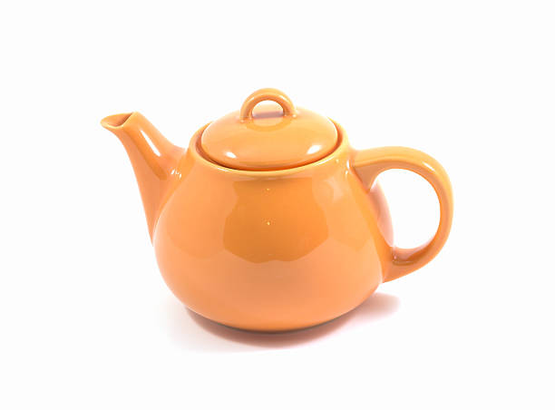 istock Orange teapot isolated on white background 531173617
