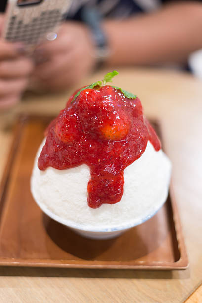 Blur motion, Shaved ice with milk and strawberry jam very Good tasteBlur motion, Shaved ice with milk and strawberry jam very Good taste