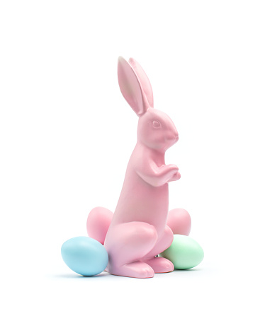 Pastel-coloured pink easter bunny with pastel-coloured easter eggs