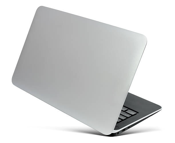 istock Flying thin aluminium laptop, rear view,  isolated on a white 531176808