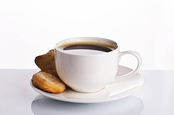 istock cup of black coffee with cookies 531177256