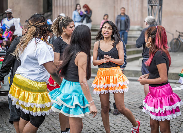 Young women parading in the Copenhagen Whitsun Carnival, 2016. Copenhagen, Denmark - May 14, 2016: Young women ready to enter the parade in the Copenhagen Whitsun Carnival, 2016. whitsun stock pictures, royalty-free photos & images