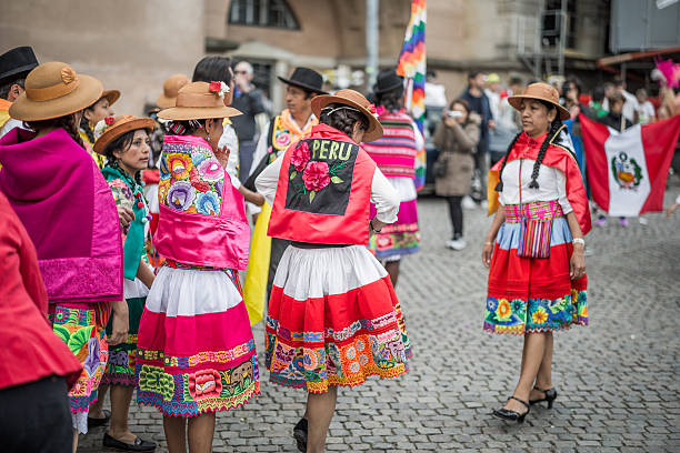 Peruvian women in the Copenhagen Whitsun Carnival, 2016 Copenhagen, Denmark - May 14, 2016: A group of Peruvian women and a man ready to enter the parade in the Copenhagen Whitsun Carnival, 2016. whitsun stock pictures, royalty-free photos & images