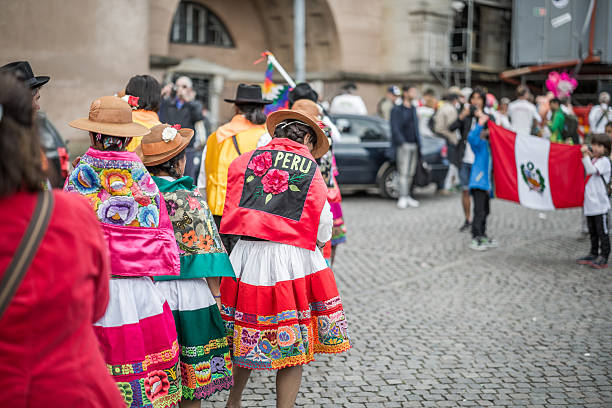 Peruvian women in the Copenhagen Whitsun Carnival, 2016 Copenhagen, Denmark - May 14, 2016: A group of Peruvian women and a man ready to enter the parade in the Copenhagen Whitsun Carnival, 2016. whitsun stock pictures, royalty-free photos & images