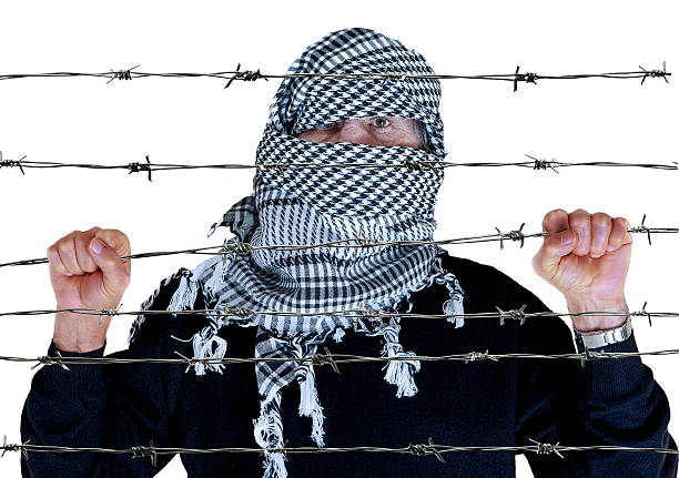 istock palestinian wear with keffiyeh 531178141