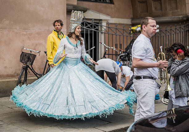 Young woman parading in the Copenhagen Whitsun Carnival, 2016. Copenhagen, Denmark - May 14, 2016: Young woman in beautiful costume ready to enter the parade in the Copenhagen Whitsun Carnival, 2016. whitsun stock pictures, royalty-free photos & images