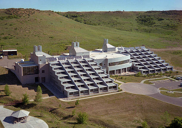 West of downtown Denver on South Table Mountain in Golden, Colorado stands modern architecture of the Solar Energy Research Facility building, part of the Department of Energy's National Renewable Energy Laboratory which specializes in solar, wind, alternative fuels, geothermal and other renewable energy research and development. Solar panels stand on top of the building with its daylighting stair-step design.