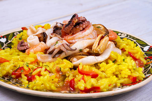 istock Seafood: shrimps, squid, mussels and octopus. Rice as a garnish 531178310