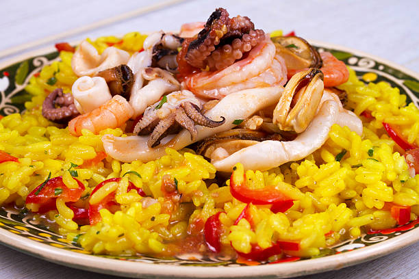 istock Seafood: shrimps, squid, mussels and octopus. Rice as a garnish 531178370