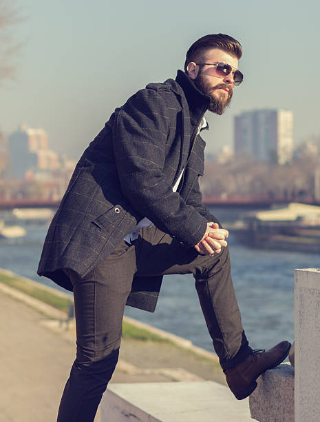 istock Hipster style bearded man posing on stairs 531178479