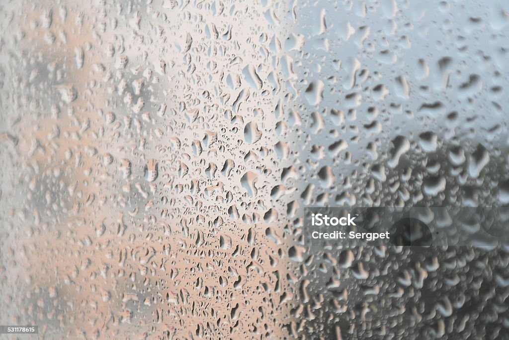 On a summer raining day On a summer raining day. Drops of water on the window. Shallow DOF 2015 Stock Photo