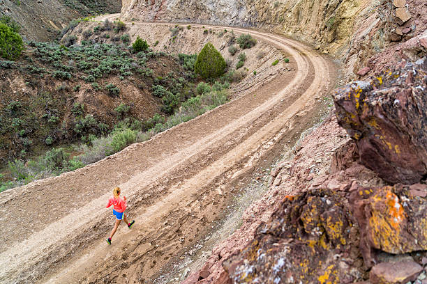 istock Woman Running on Dirt Road 531178750