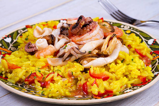 istock Seafood: shrimps, squid, mussels and octopus. Rice as a garnish 531178772