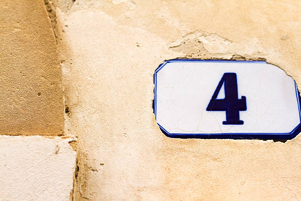 istock Number 4 Ceramic Street Address Tile on Old Tan Wall 531178808
