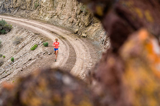 istock Woman Running on Dirt Road 531179408
