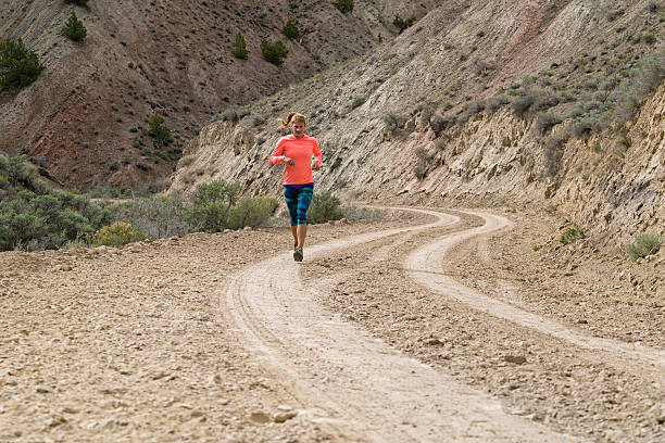 istock Woman Running on Dirt Road 531179766
