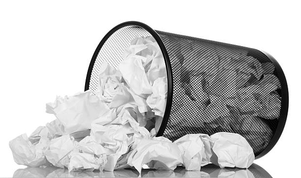 istock Office basket with crumpled paper isolated on white 531182488