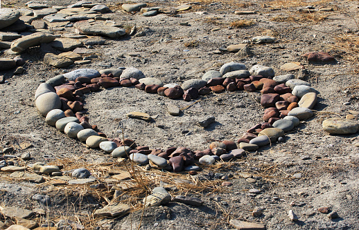 Heart shaped design made by rearranging stones at the beach