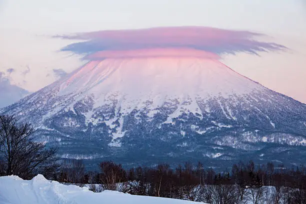 Mt Yotei Purple Sunset. Mount Yotei is a large volcano near Niseko, Kutchan, Otaru, and Sapporo in Hokkaido Japan.