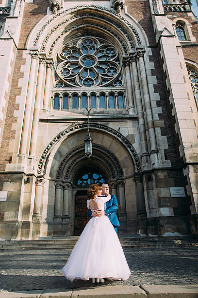 istock Happy gorgeous bride and stylish handsome groom on background of 531185642