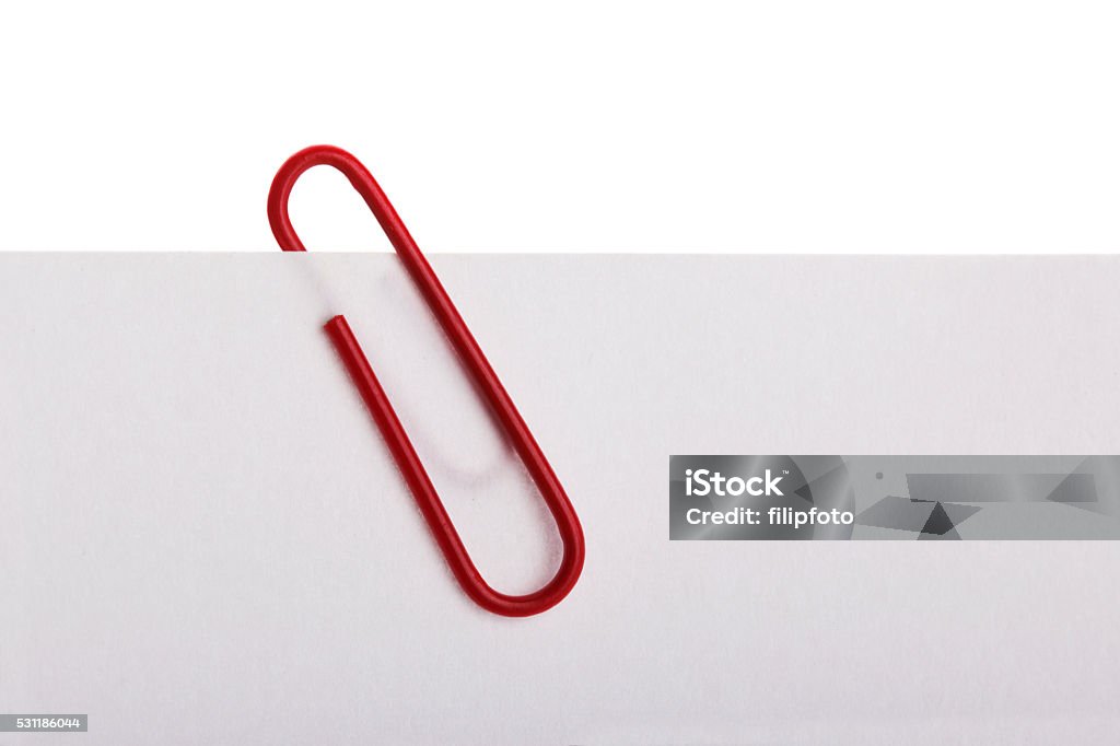 Paper clip Paper clip with paper. Attached Stock Photo