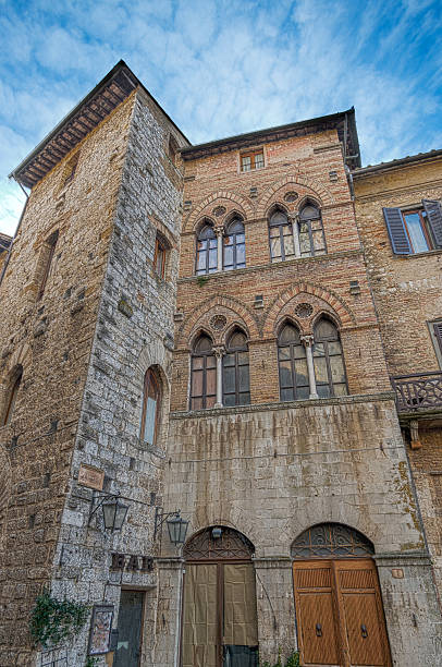 Street view of the old town of San Gimignano in Siena Province in the morning, Italy