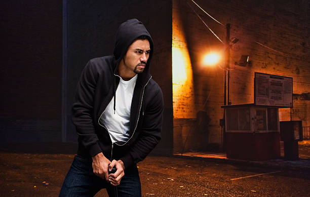 istock Robber with handgun at night in the city 531186838