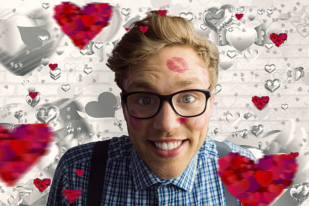 istock Composite image of geeky hipster covered in kisses 531188863