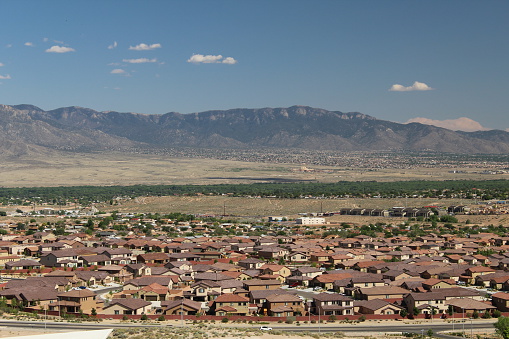 The urban sprawl of Albuquerque suburb, Rio Rancho with the Sandia Mountains in the background.