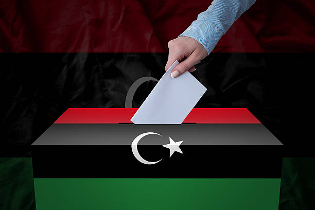 Ballot Box - Election - Libya A hand casting a vote in a ballot box for an election in the Libya dnc stock pictures, royalty-free photos & images