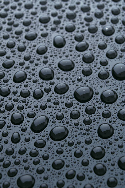 Shiny Water Droplets or Bubbles on Smooth Surface stock photo