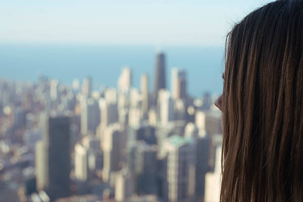 istock anonymous woman overlooking large american city 531191468