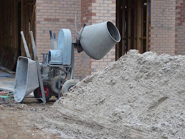 istock Wheelbarrow and mixer on a residential building site 531194652