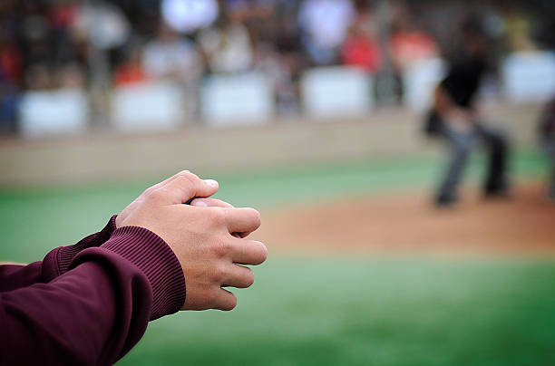 istock Sports Spectator Watching Umpire At Baseball Game 531196260