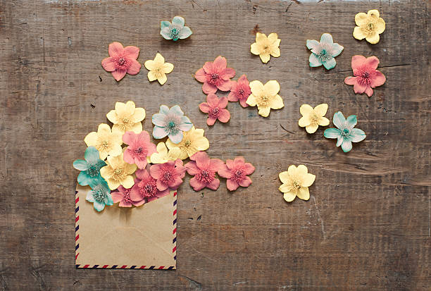 beautiful flowers in the old envelope beautiful flowers in the old envelope on wooden table prom invite stock pictures, royalty-free photos & images