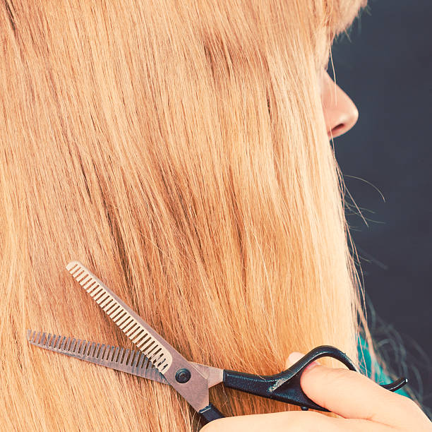 istock Blonde girl makes new hair image. 531198404
