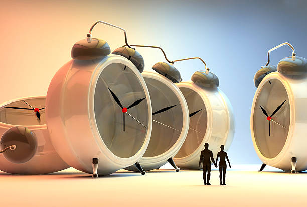 istock tiny people and alarm clocks, time passing concept 531208779