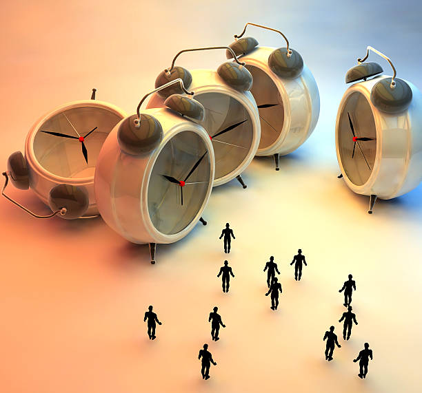 istock tiny people and alarm clocks, time passing concept 531209277