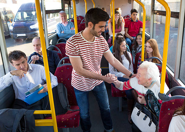 Young Man Helping Senior Woman